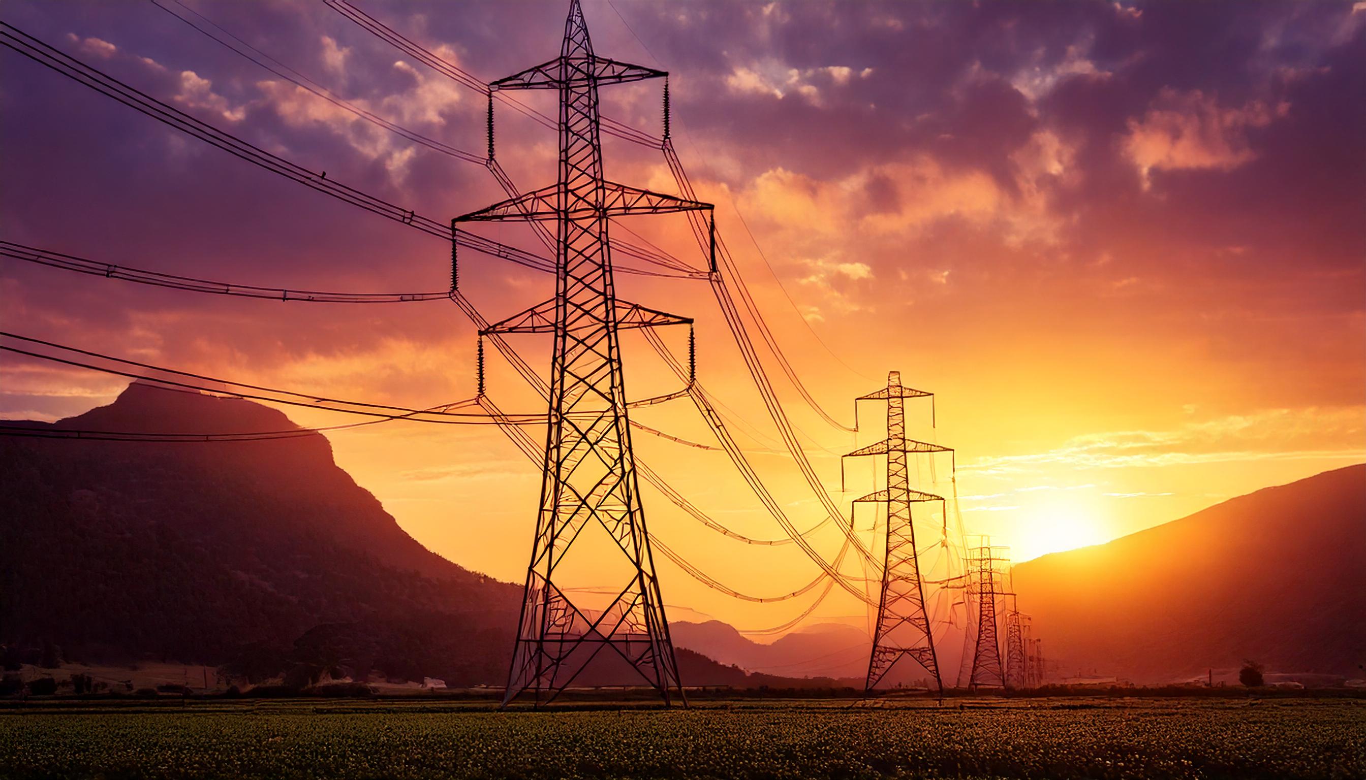 AuDHD special interest - High-voltage pylons stretching into the distance at sunset, with a glowing orange and purple sky over a serene landscape.
